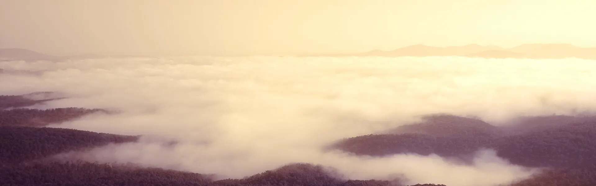 Cloud lying low over hills